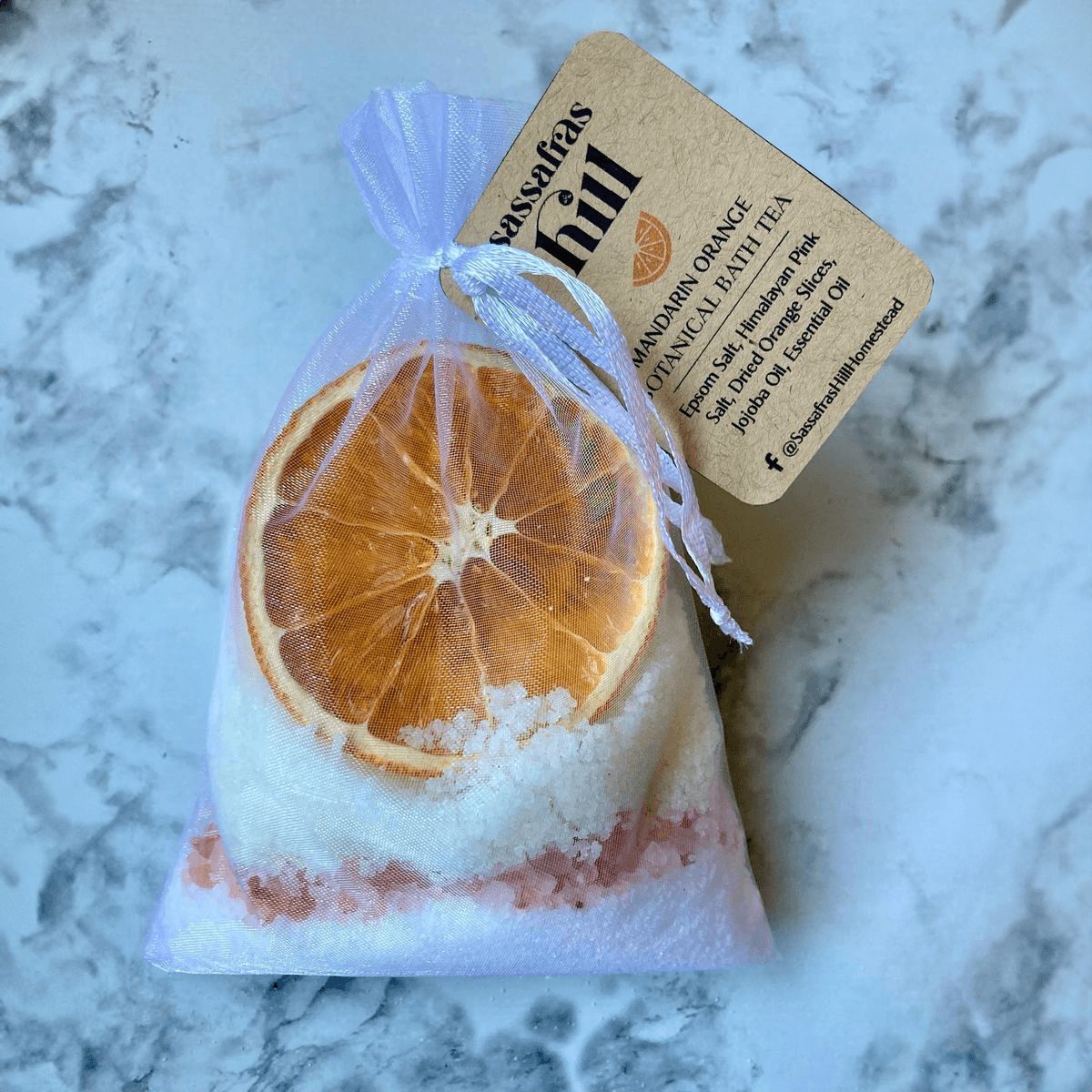 Botanicals, essential oils and minerals in a bath soak sachet made by Sassafras Hill.