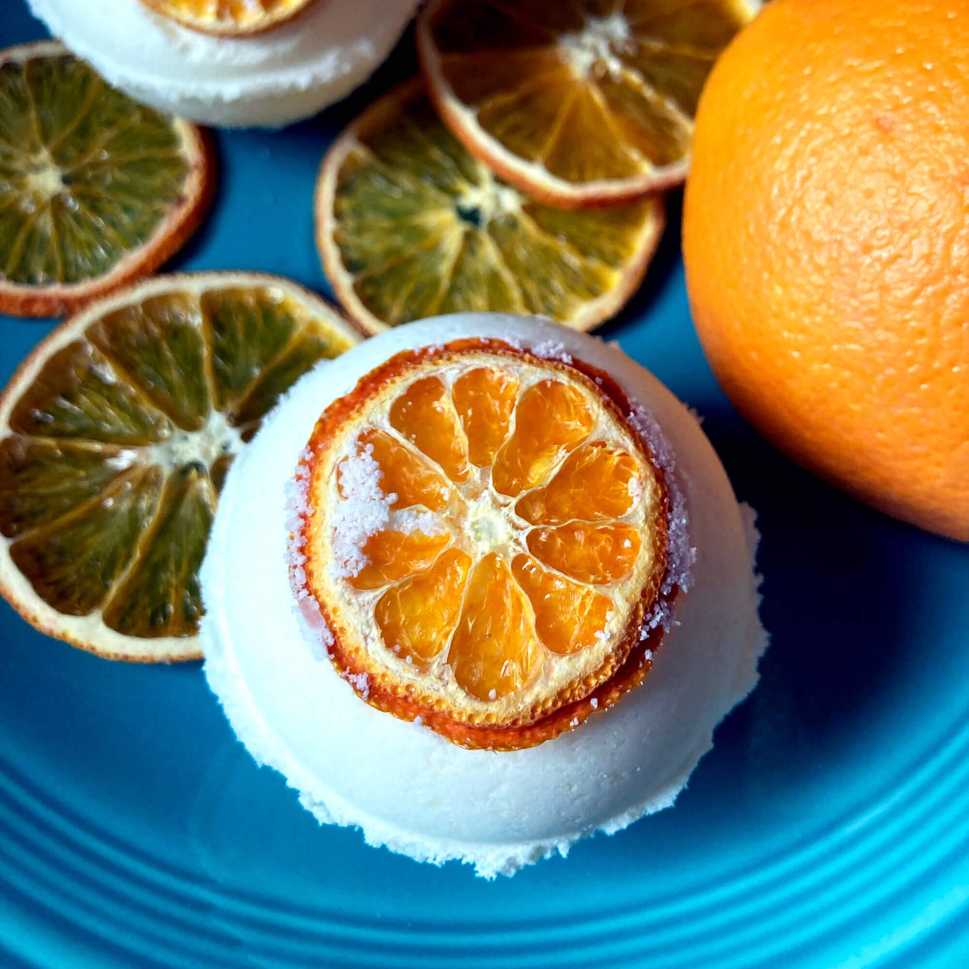 Close up of handmade bath bomb with extra fizzing action, orange scent, made by Sassafras Hill