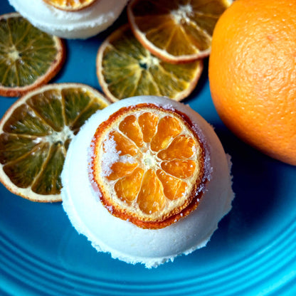 Close up of handmade bath bomb with extra fizzing action, orange scent, made by Sassafras Hill