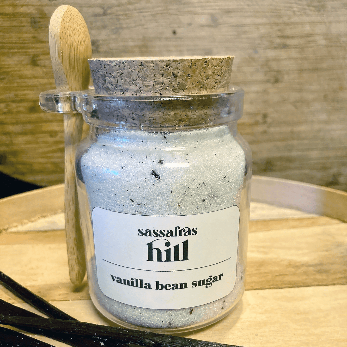 Closed decorative jar of Vanilla Bean Sugar by Sassafras Hill