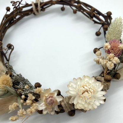 Detail of handmade beautiful wreath made with dried flowers, grasses and vines by Sassafras Hill