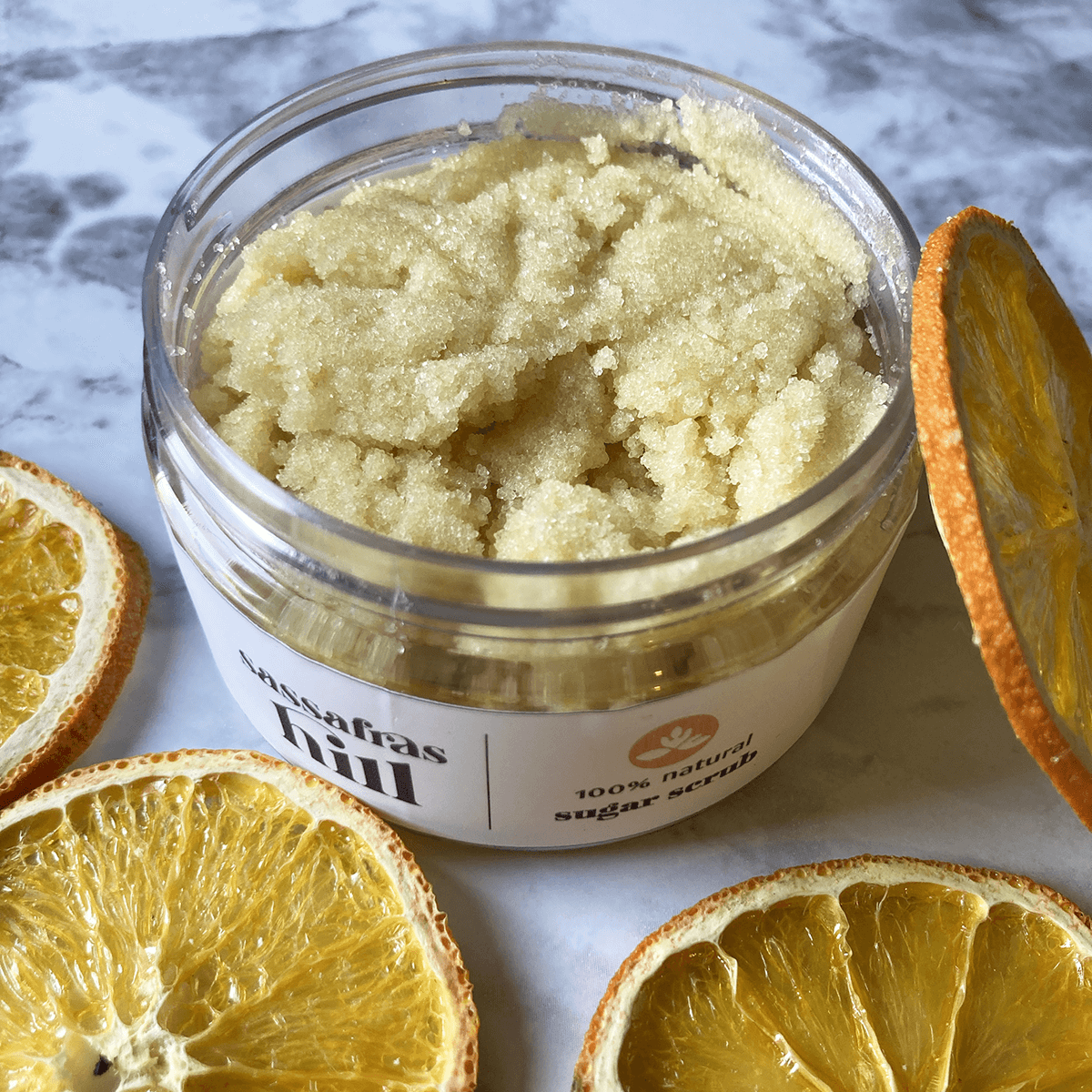 All natural exfoliating sugar scrub with cocoa butter and vitamin e, made by Sassafras Hill