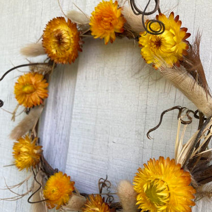 Handmade, all natural floral and grapevine wreath made by Sassafras Hill