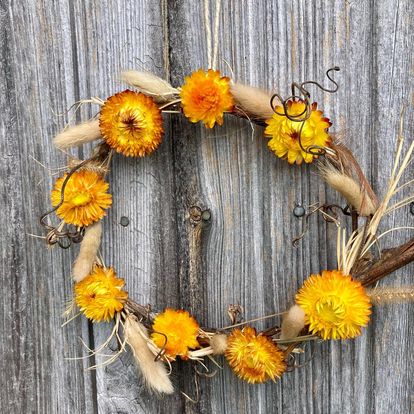 Small handcrafted wreath with dried grasses, vines and flowers by Sassafras Hill