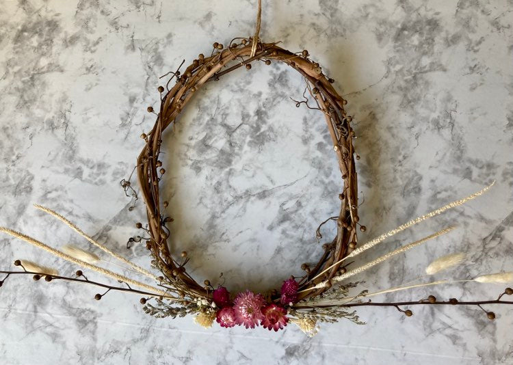 Handcrafted wreath with dried grasses, moth mullien, vines and flowers by Sassafras Hill